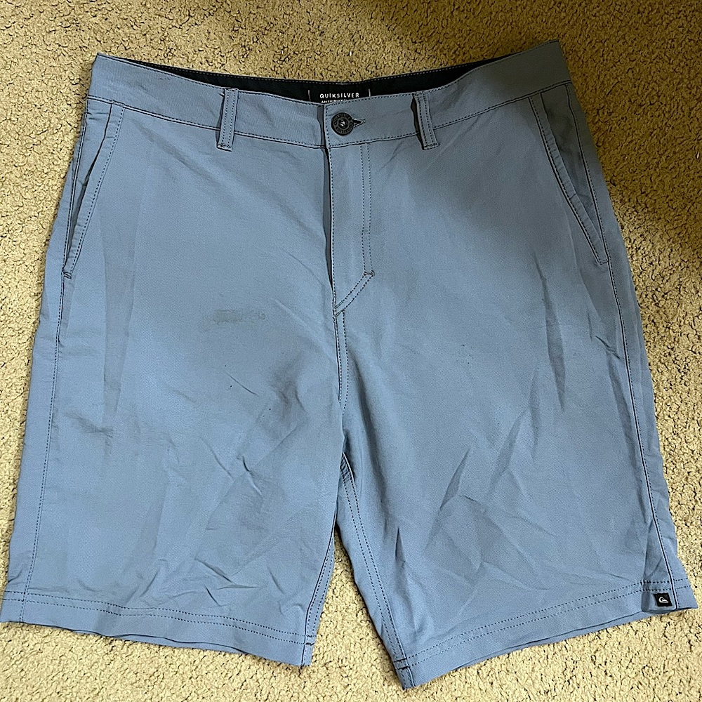 Navy Quiksilver hybrid shorts , size 32 .